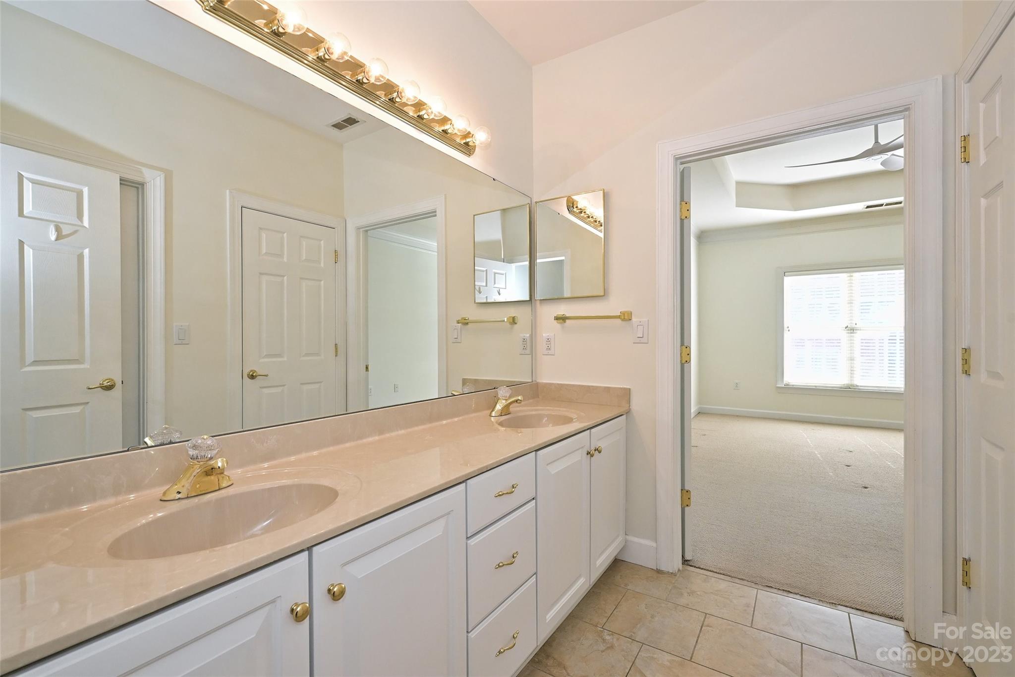 8445 Windsor Ridge Drive Charlotte, NC 28277 - Photo 20 of 26 a bathroom with a sink and a mirror
