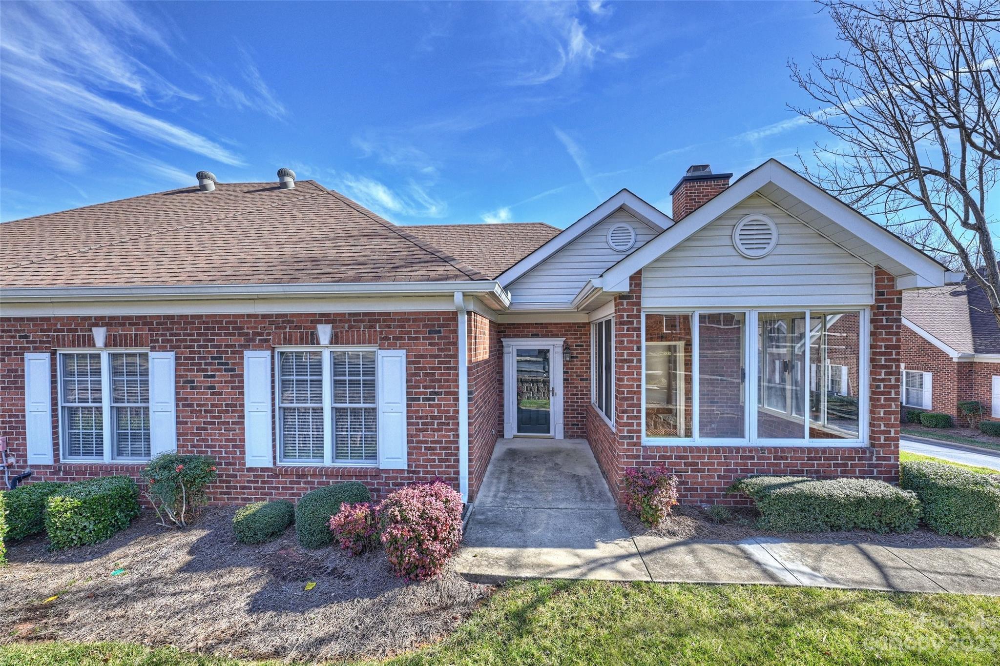 8445 Windsor Ridge Drive Charlotte, NC 28277 - Photo 2 of 26 a front view of a house with garden