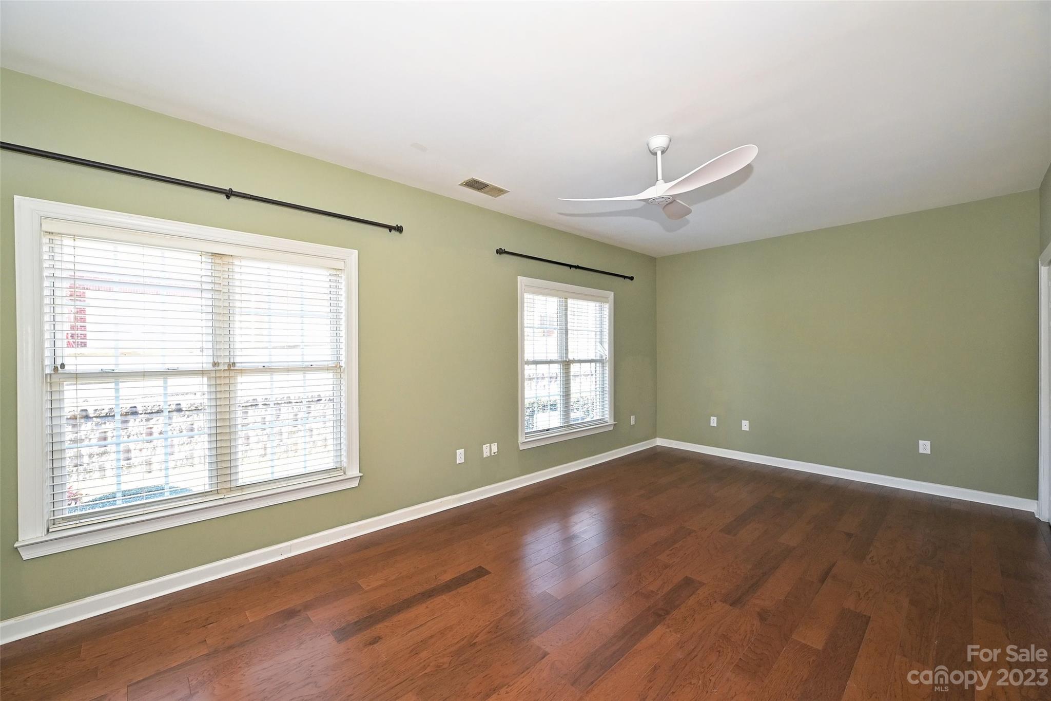8445 Windsor Ridge Drive Charlotte, NC 28277 - Photo 22 of 26 a view of an empty room with wooden floor and a window