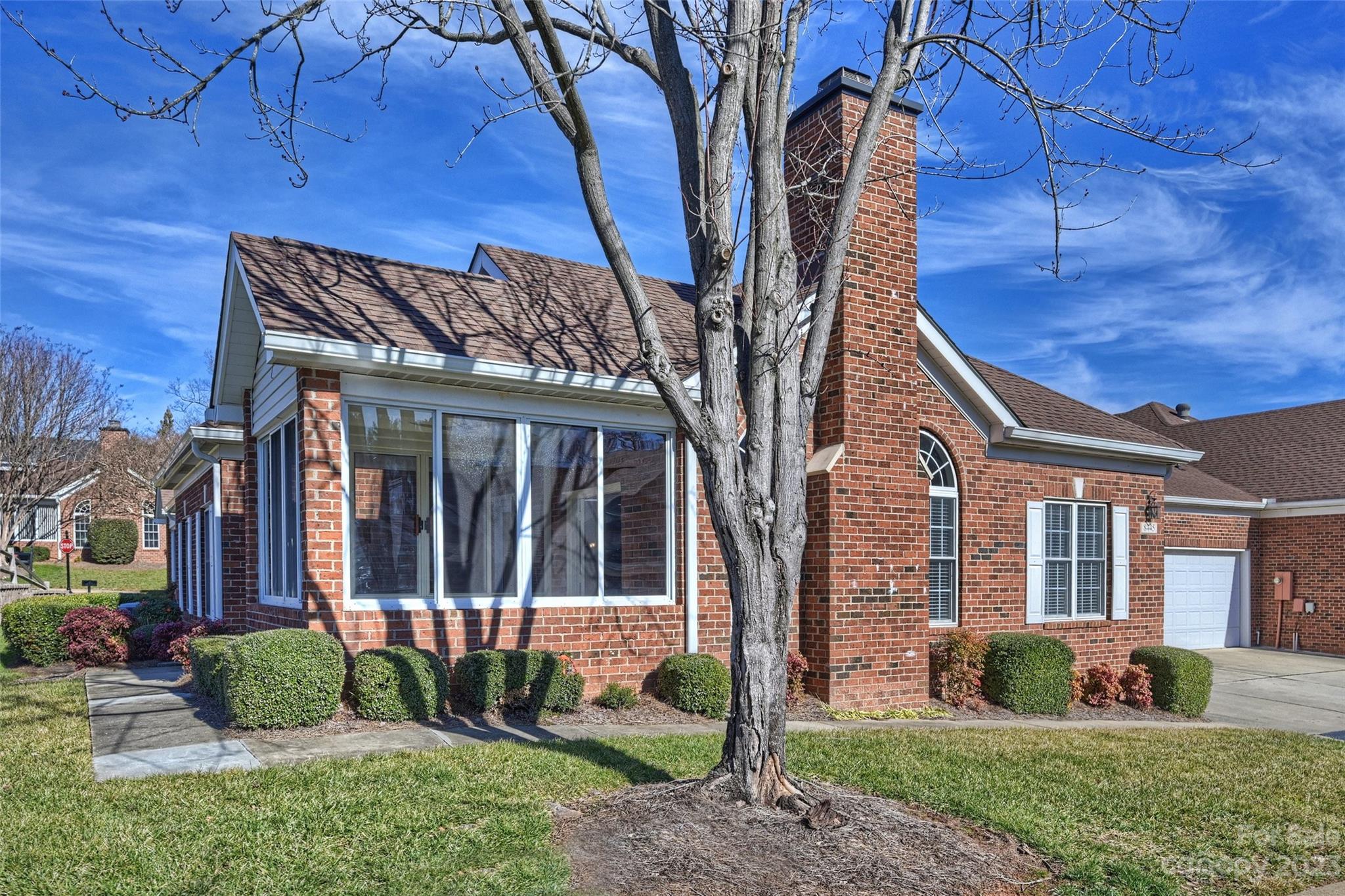 8445 Windsor Ridge Drive Charlotte, NC 28277 - Photo 3 of 26 a view of a house with a yard and wooden fence