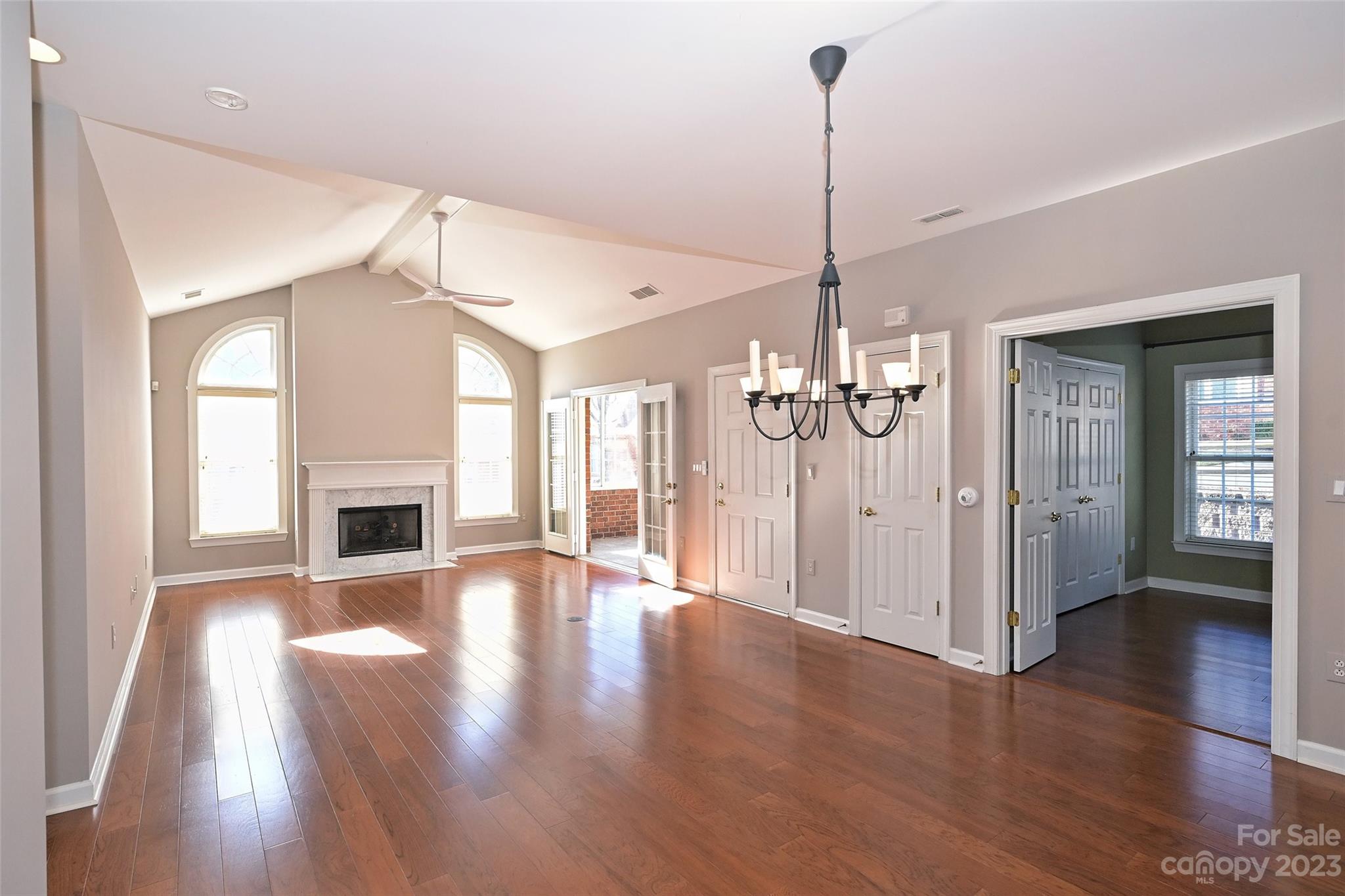 8445 Windsor Ridge Drive Charlotte, NC 28277 - Photo 5 of 26 a view of a room with wooden floor fireplace and a window