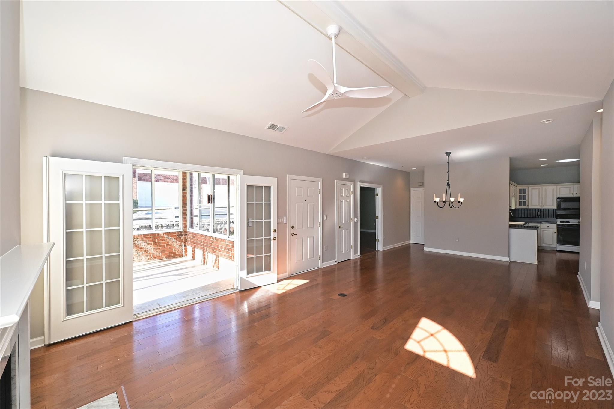 8445 Windsor Ridge Drive Charlotte, NC 28277 - Photo 9 of 26 a view of an empty room with wooden floor and a window