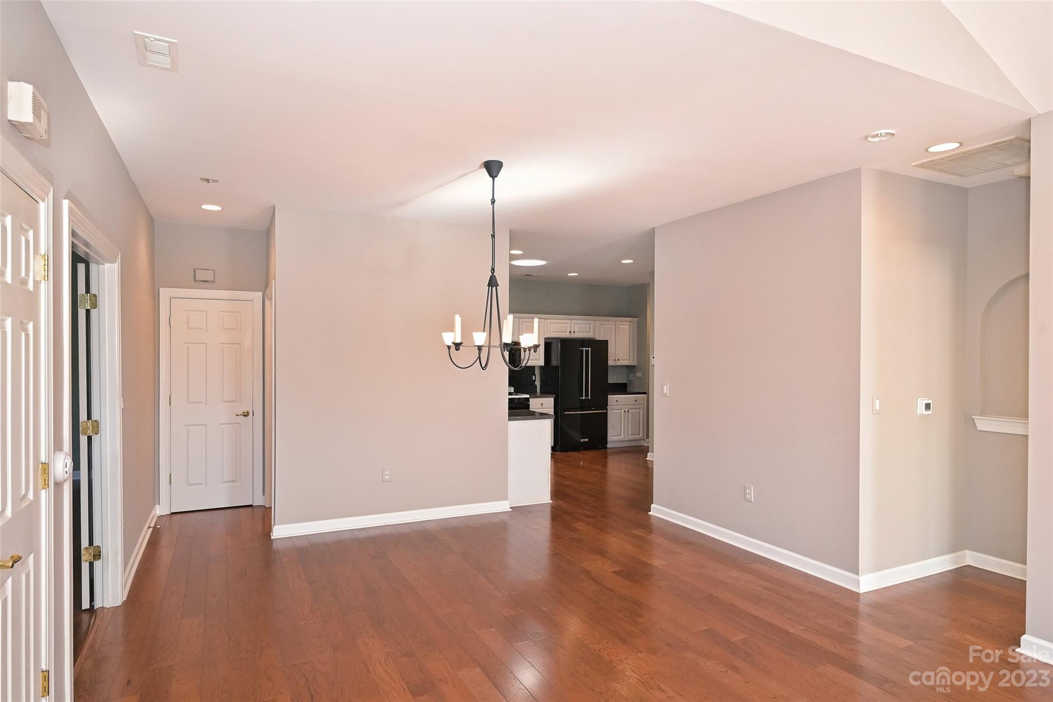 8445 Windsor Ridge Drive Charlotte, NC 28277 - Photo 10 of 26 a view of empty room with wooden floor
