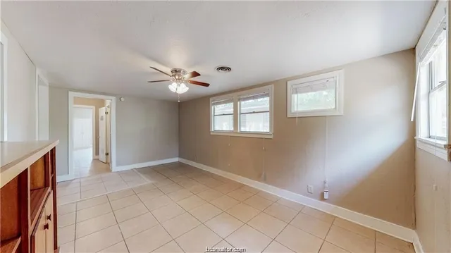 a view of an empty room with a window