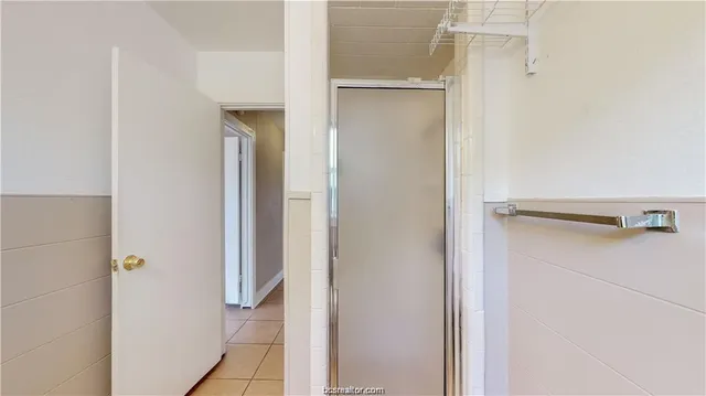 a view of a backyard with wooden fence