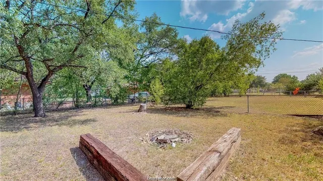a view of road with large trees