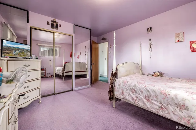 a bedroom with a bed and a cabinets