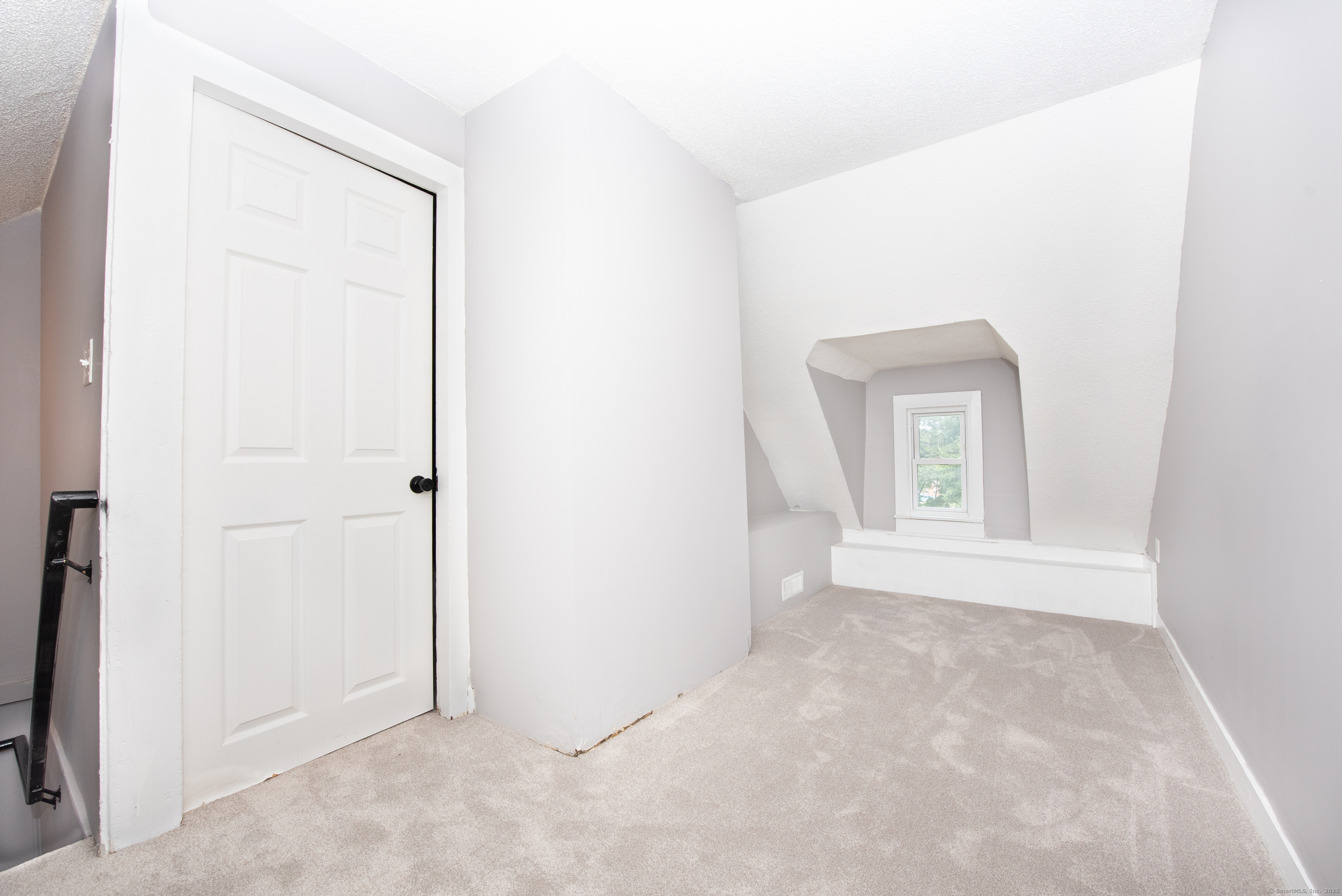 6 Crescent Street Ansonia, CT 06401 - Photo 17 of 25 a view of an empty room with a window