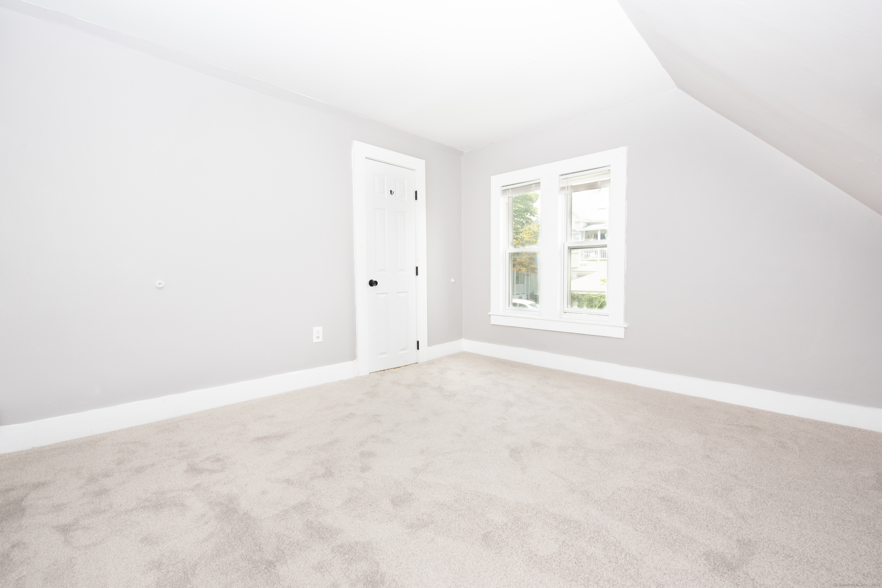 6 Crescent Street Ansonia, CT 06401 - Photo 21 of 25 an empty room with windows and closet