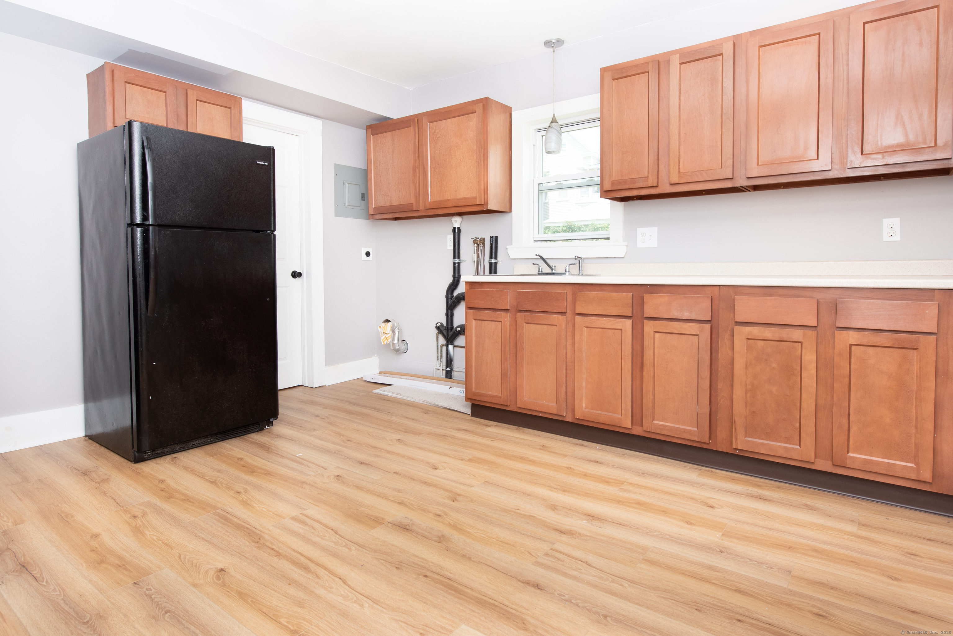 6 Crescent Street Ansonia, CT 06401 - Photo 3 of 25 a kitchen with stainless steel appliances granite countertop a refrigerator and a stove top oven
