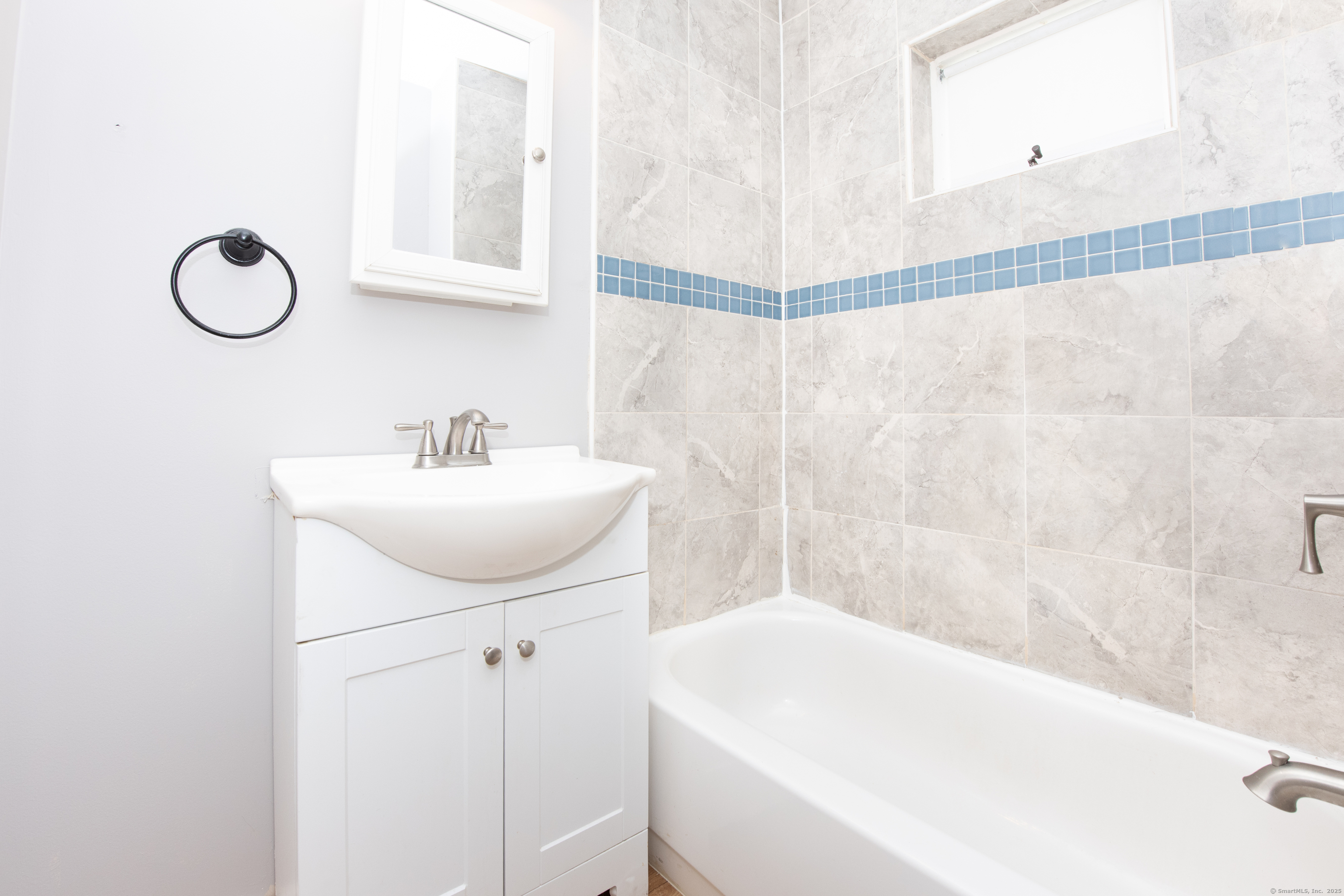 6 Crescent Street Ansonia, CT 06401 - Photo 8 of 25 a bathroom with a sink and a mirror