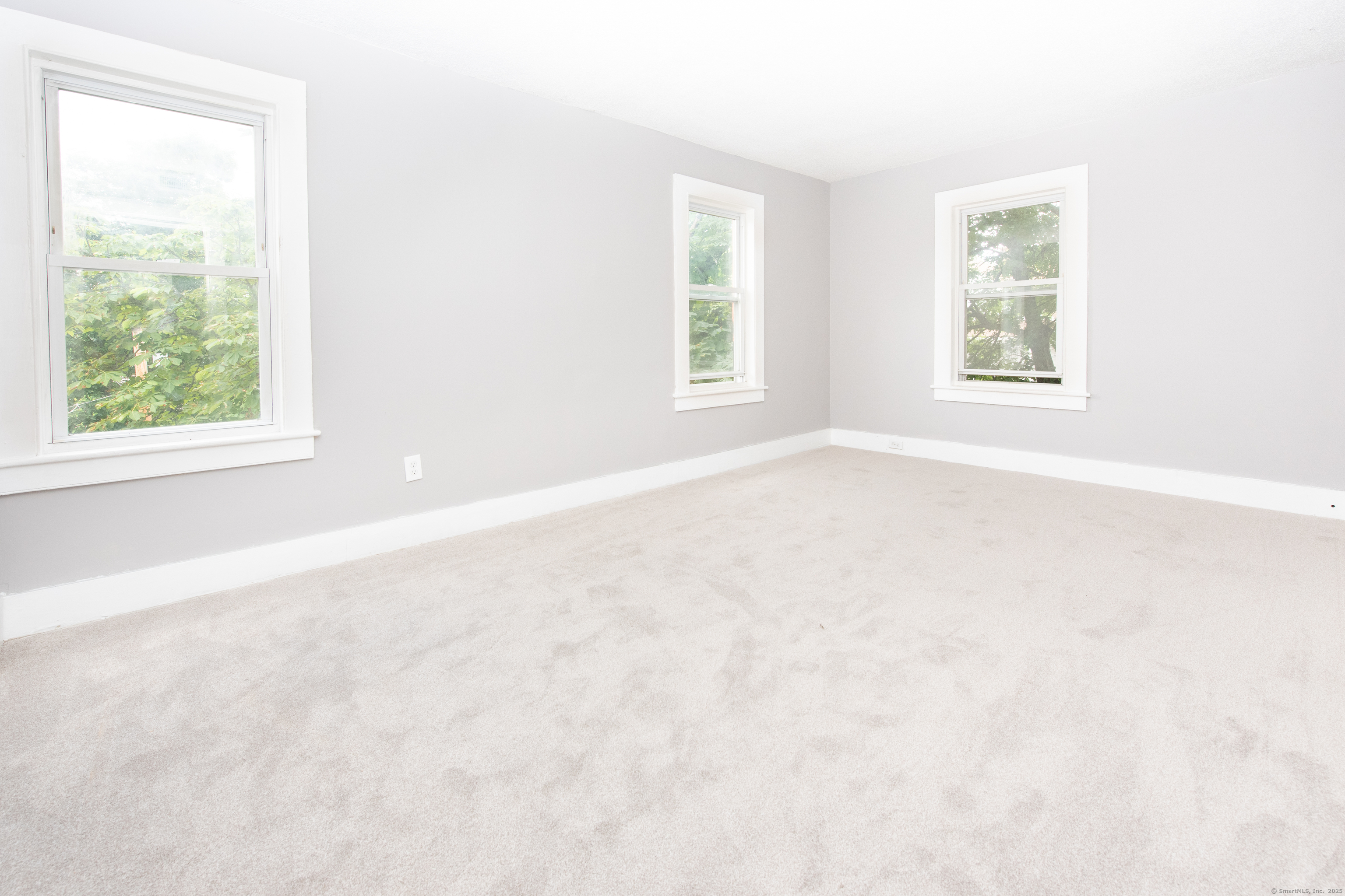 6 Crescent Street Ansonia, CT 06401 - Photo 9 of 25 an empty room with windows
