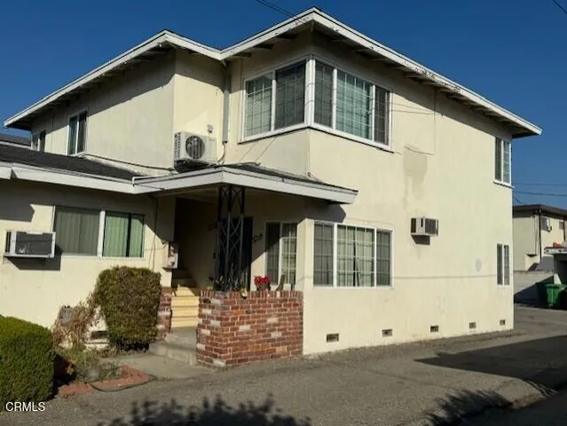 a front view of a house with a garage
