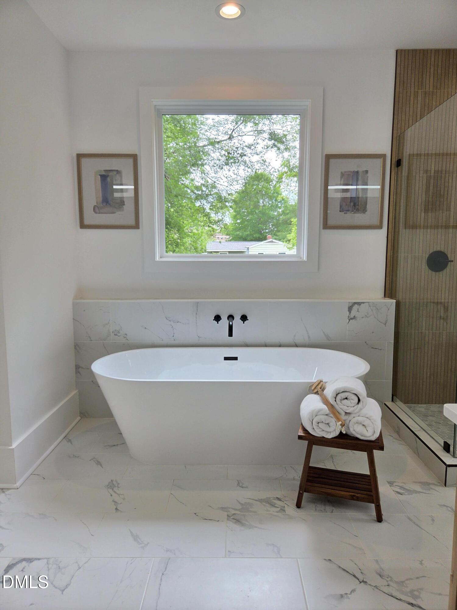 712 Van Buren Road Raleigh, NC 27604 - Photo 11 of 34 a bathroom with a sink and a bathtub