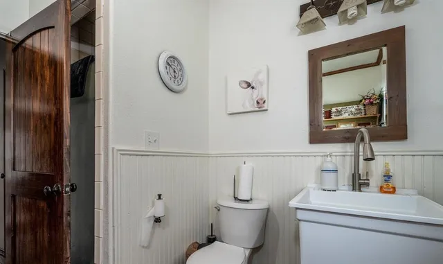 a bathroom with a toilet and a sink