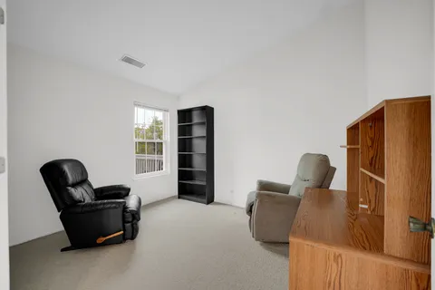 a view of livingroom with furniture and a couch