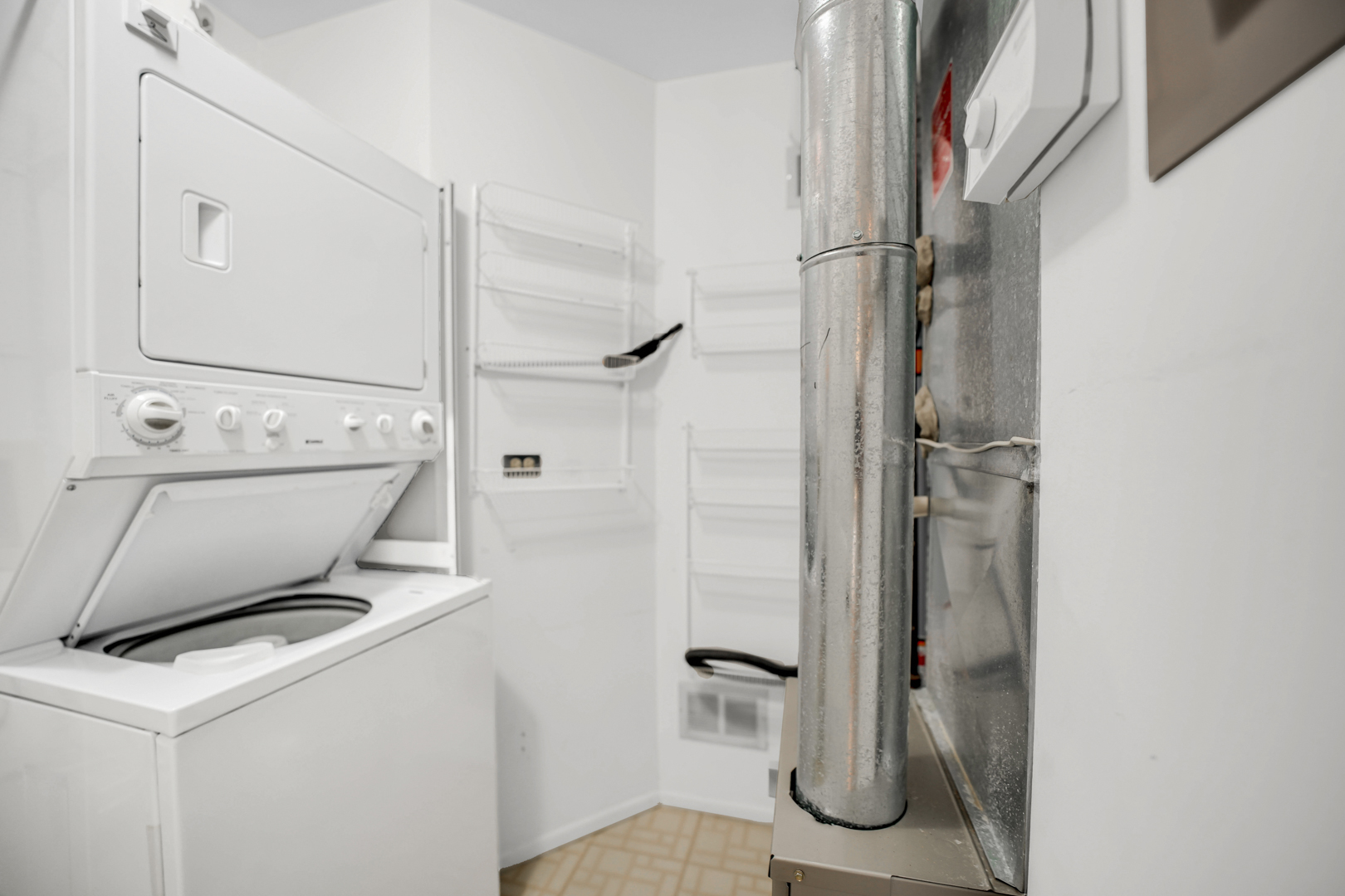 62 Winding Run Lane, Unit 62 Streamwood, IL 60107 - Photo 19 of 20 a bathroom with a sink a toilet and shower