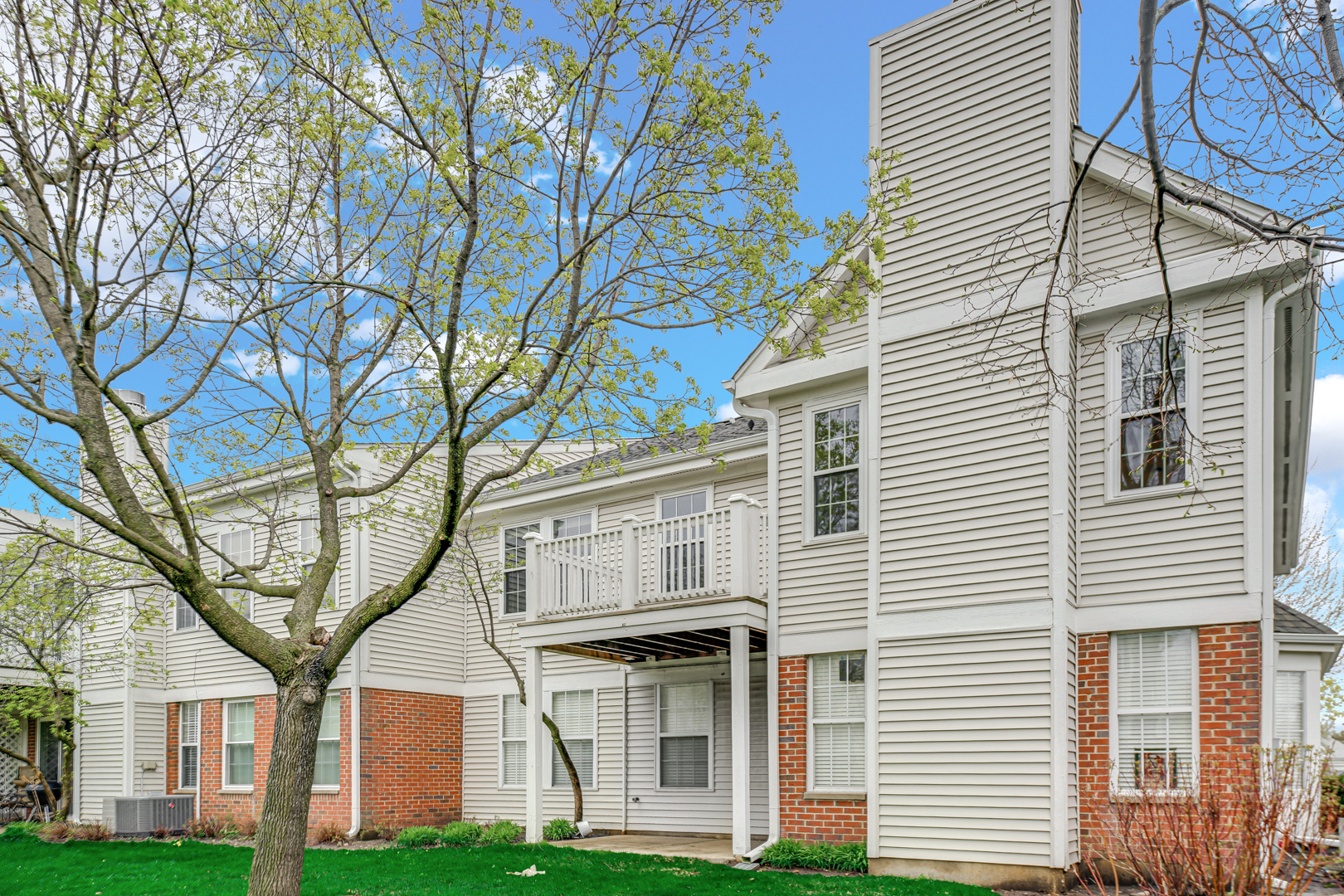 62 Winding Run Lane, Unit 62 Streamwood, IL 60107 - Photo 20 of 20 a view of a white house next to a yard