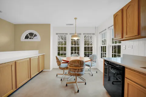 a view of a workspace with furniture