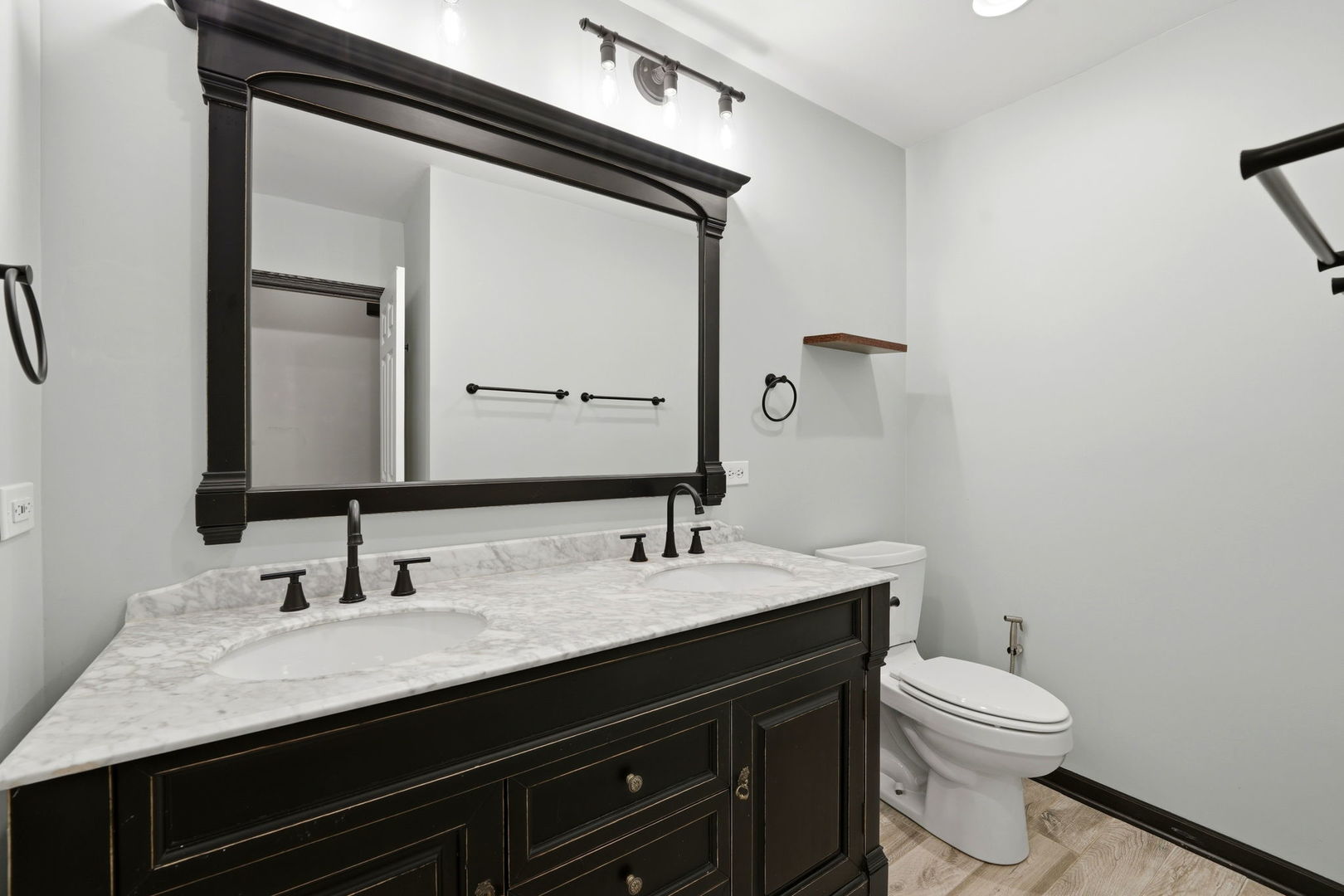 619 North Racine Avenue, Unit 1 Chicago, IL 60642 - Photo 25 of 36 a bathroom with a granite countertop sink toilet and mirror