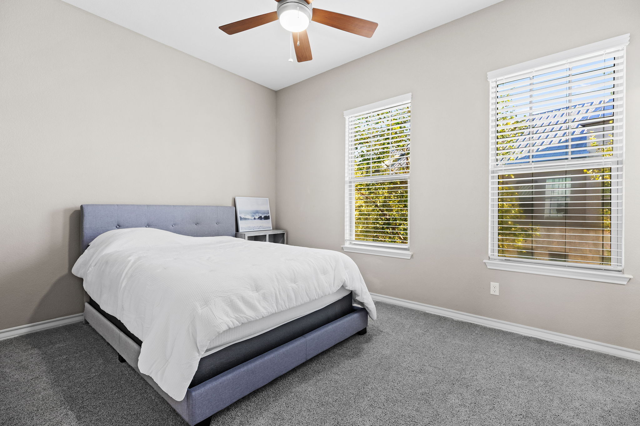 1125 Highknoll Lane Georgetown, TX 78628 - Photo 26 of 40 a bed sitting in a bedroom next to a window