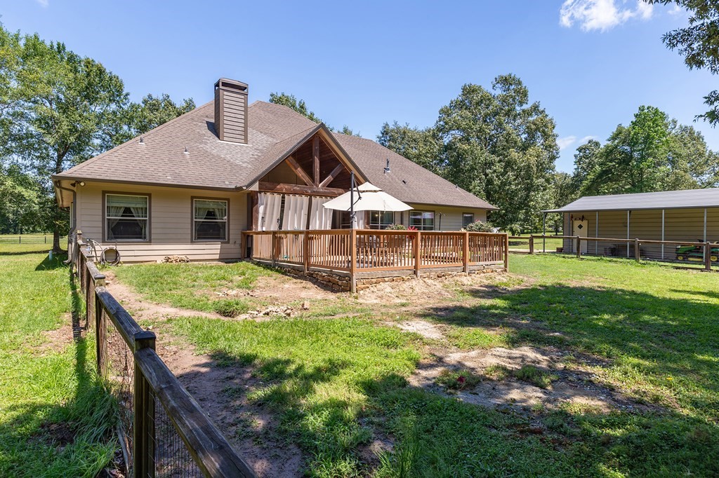 1171 Old Ewing Road Lufkin, TX 75901 - Photo 33 of 49 a front view of a house with a yard table and chairs