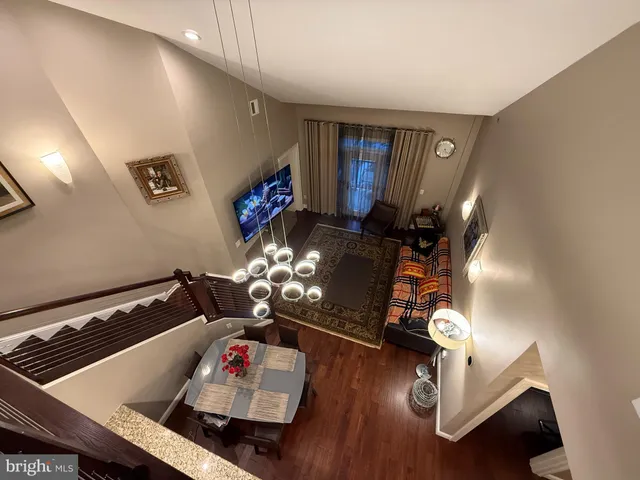 a living room with hard wood flooring and a couch