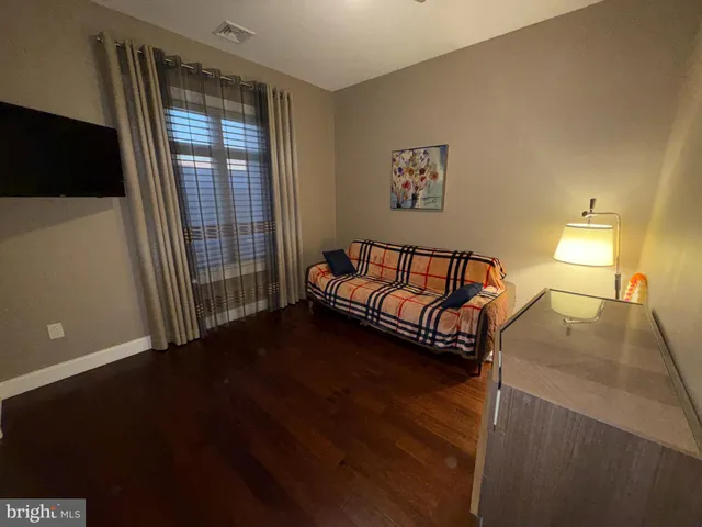 a view of a livingroom with furniture and a window
