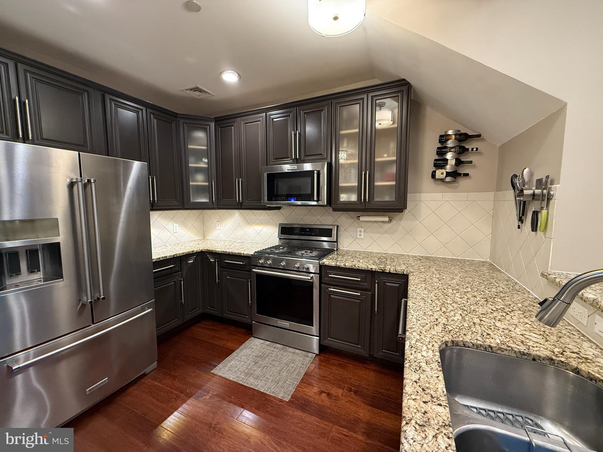 503 Carson Terrace Huntingdon Valley, PA 19006 - Photo 6 of 33 a kitchen with granite countertop stainless steel appliances and wooden cabinets