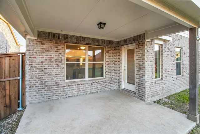 a view of a house with a garden and yard