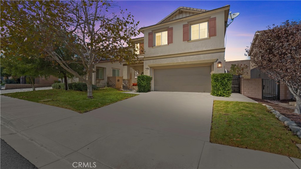 3641 Bur Oak Road San Bernardino, CA 92407 - Photo 19 of 20 a front view of a house with a yard and garage