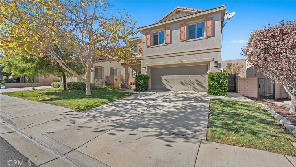 3641 Bur Oak Road San Bernardino, CA 92407 - Photo 2 of 20 a front view of a house with garden