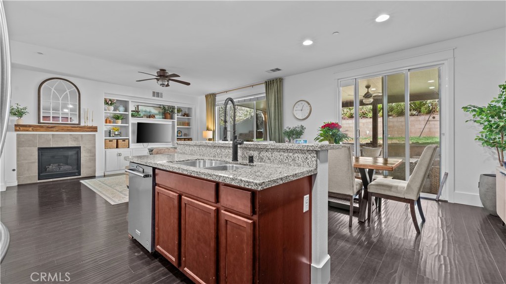 3641 Bur Oak Road San Bernardino, CA 92407 - Photo 7 of 20 a kitchen with a table chairs and wooden floor