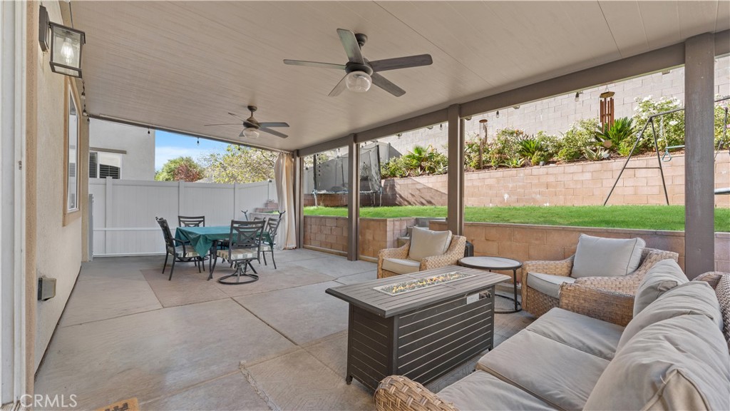 3641 Bur Oak Road San Bernardino, CA 92407 - Photo 8 of 20 a living room with furniture and a large window