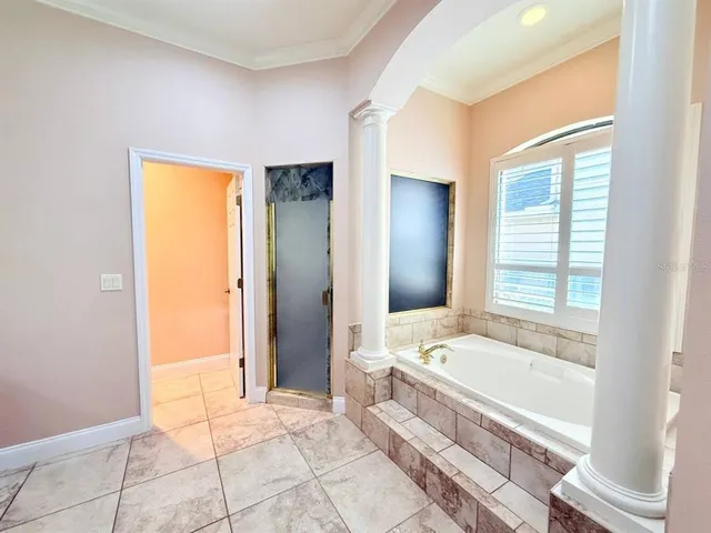 a bathroom with a granite countertop toilet a sink and a mirror