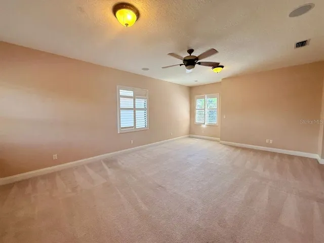 a kitchen with stainless steel appliances granite countertop a sink a stove cabinets and wooden floor