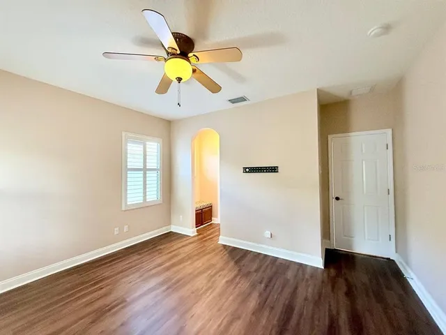 a view of a livingroom with walk in closet and window