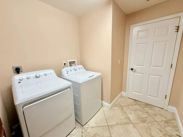 a view of a house with swimming pool