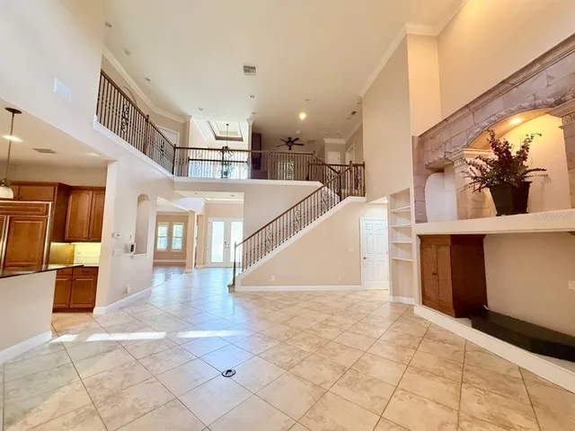 a view of a livingroom with an empty space and a fireplace