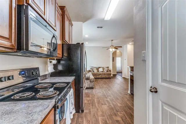 a kitchen with a stove and a refrigerator