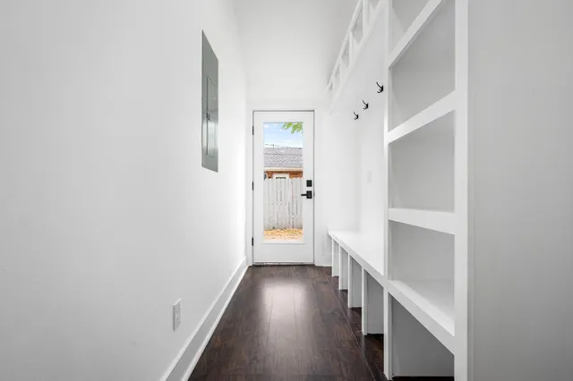 a view of an entryway with wooden floor