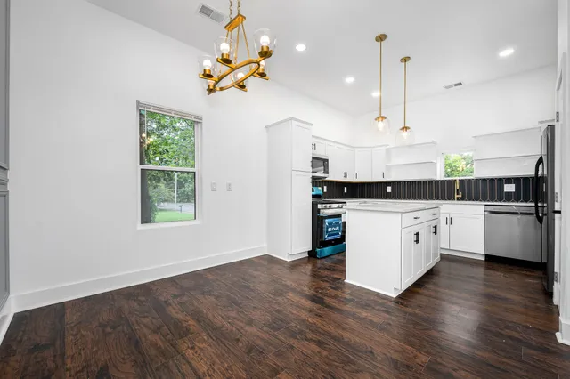 a view of kitchen with wooden floor
