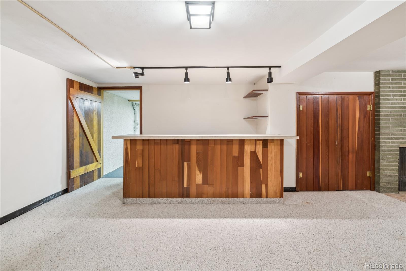 4185 Pierce Street Wheat Ridge, CO 80033 - Photo 15 of 27 a view of a room with wooden walls