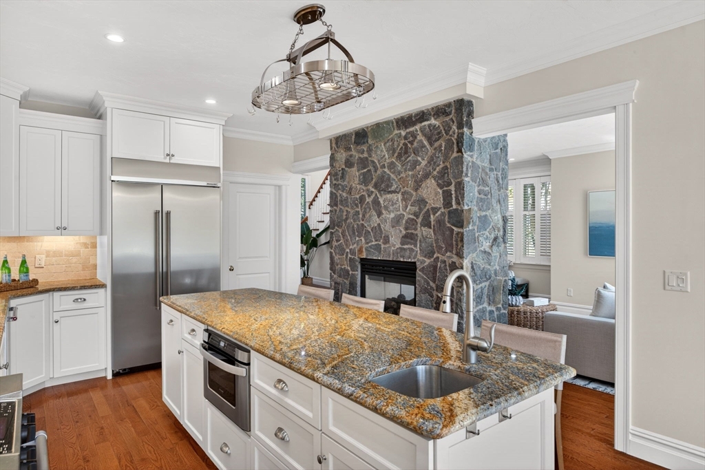 2 Quinns Way, Unit 2 Mashpee, MA 02649 - Photo 19 of 42 a kitchen with granite countertop a sink stove and refrigerator