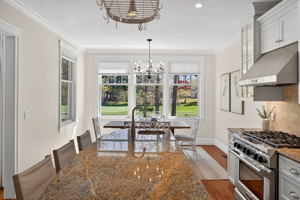 2 Quinns Way, Unit 2 Mashpee, MA 02649 - Photo 21 of 42 a living room with furniture and a chandelier