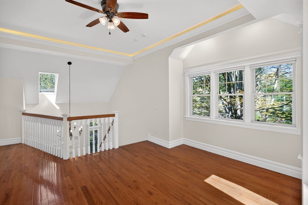 2 Quinns Way, Unit 2 Mashpee, MA 02649 - Photo 25 of 42 a view of a livingroom with wooden floor a ceiling fan and windows