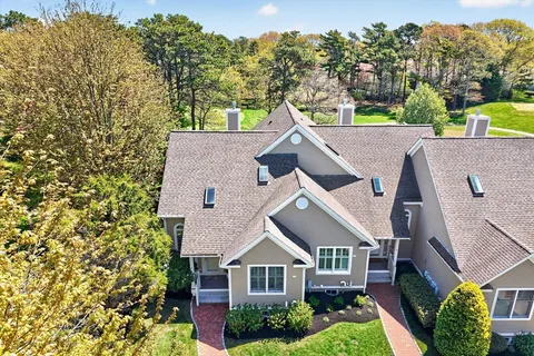aerial view of a house with a yard