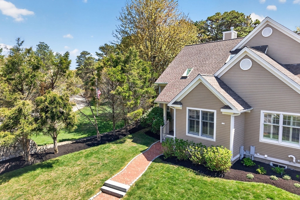 2 Quinns Way, Unit 2 Mashpee, MA 02649 - Photo 5 of 42 a aerial view of a house with a yard
