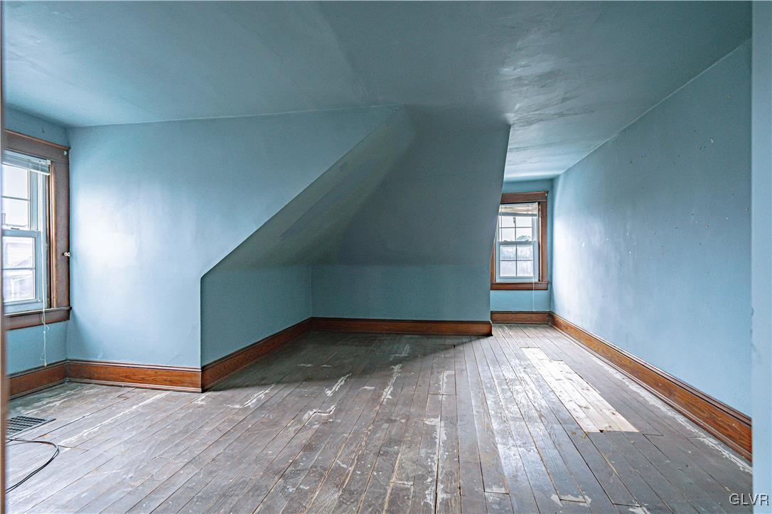 353 Hanover Street Bethlehem, PA 18018 - Photo 24 of 38 an empty room with wooden floor and windows