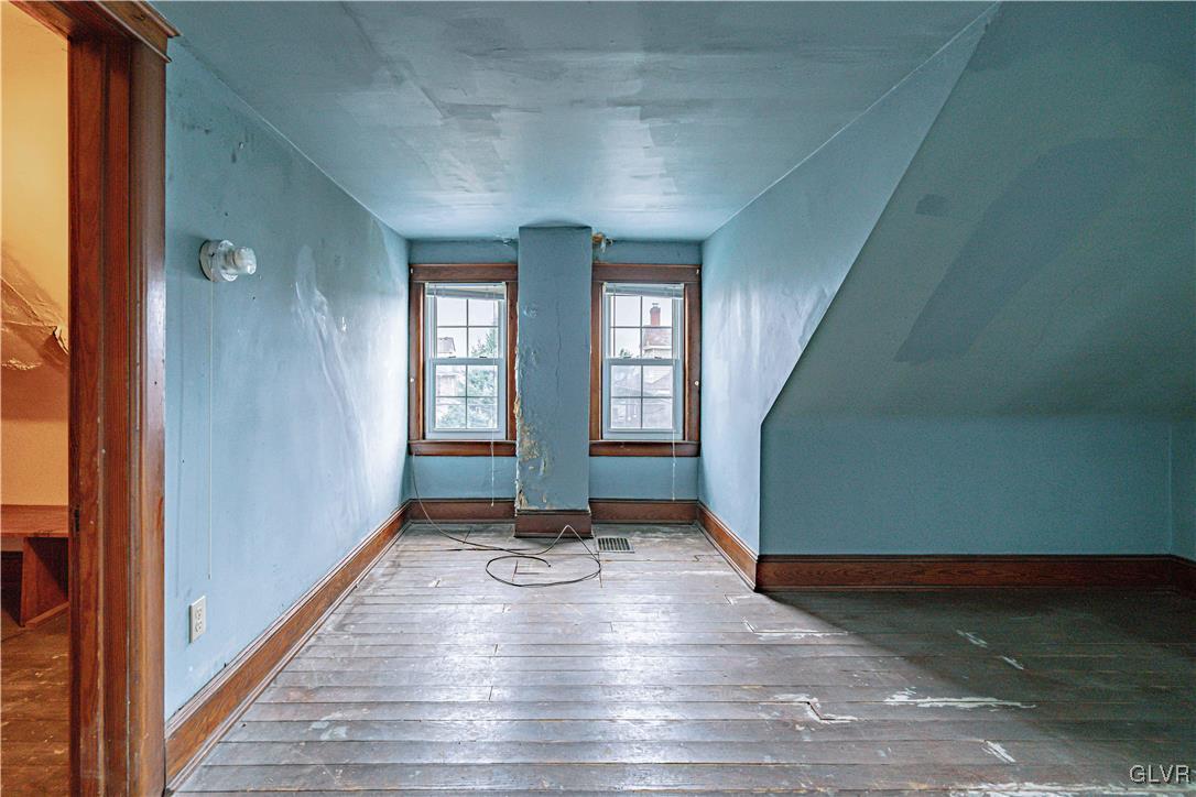 353 Hanover Street Bethlehem, PA 18018 - Photo 26 of 38 a view of an empty room with window and wooden floor